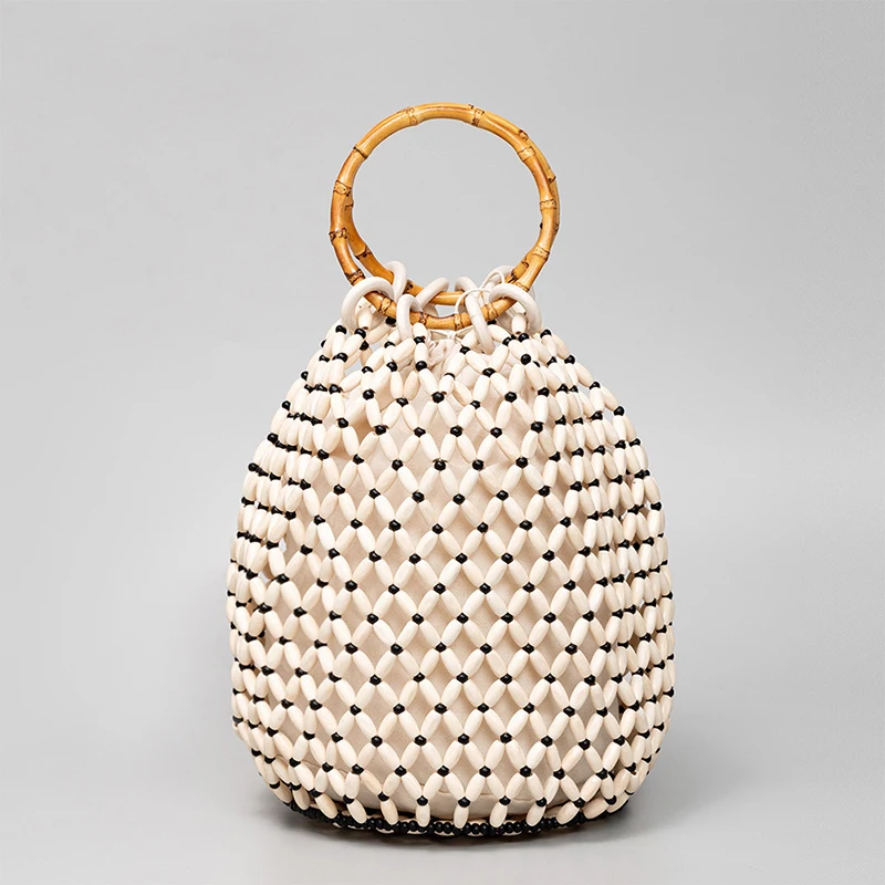  Уникальные высококачественные высококачественные женские сумки из деревянных бусин Дизайнерская бамбуковая велосипедная ручка Hollow Out Универсальные сумки-ведра в стиле пэчворк